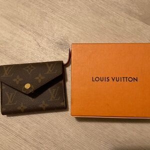 Louis Vuitton Victorine wallet in color red